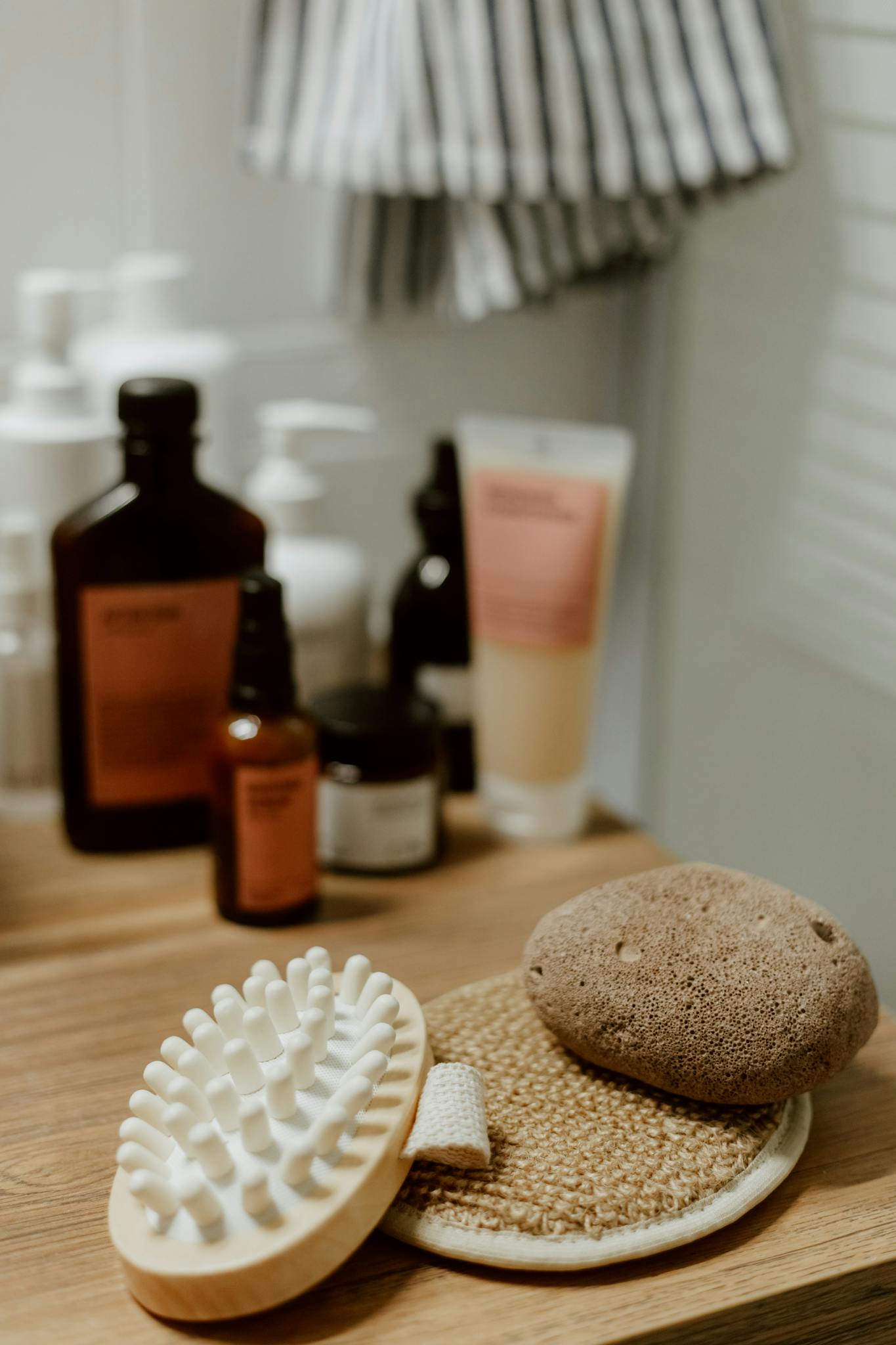 A stylish arrangement of skincare products and tools in a contemporary bathroom setting.